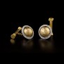 http://livballard.com/wp/wp-content/uploads/2011/11/caput-mundi-gold-cufflinks.jpg